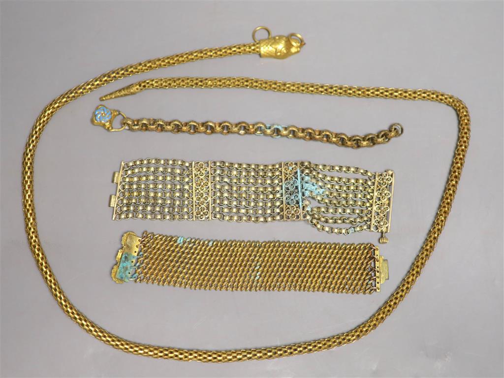 Four items of Victorian pinchbeck jewellery including a serpent necklace, 92cm and three assorted bracelets.